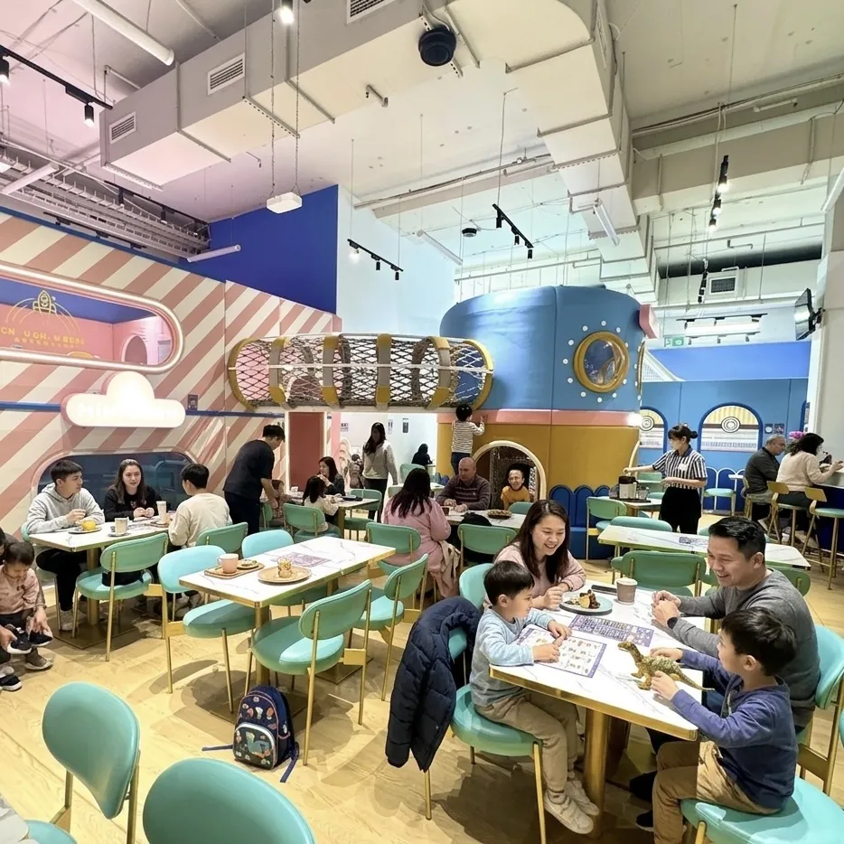 Families enjoying the space-themed café at Halo Play